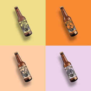 Four soda bottles in assorted flavors with yellow, peach, orange and lavender packaging pictured in grid formation.