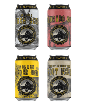 Four adjacent cans of assorted soda flavors from Rocky Mountain Soda Company's Roots and Beers Flavors variety pack