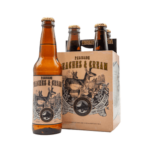 Brown bottle of Palisade Peaches and Cream soda with deer illustrations on label pictured beside four-pack