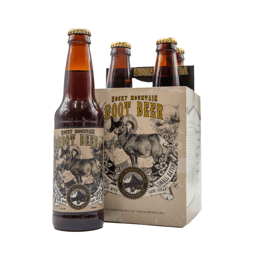 Brown bottle of Rocky Mountain Root Beer soda with bighorn sheep illustration on label pictured beside four-pack