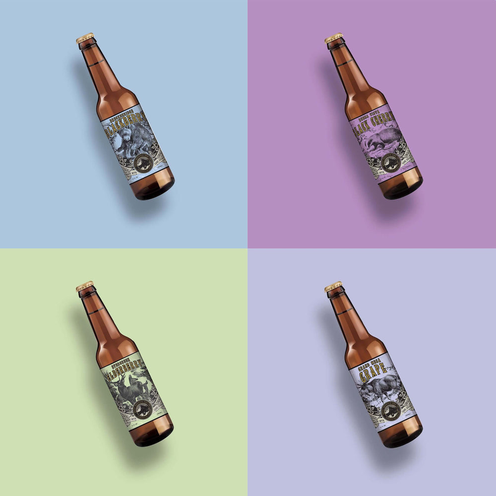 Four assorted soda bottles with yellow, peach, orange and lavender packaging pictured in grid formation.